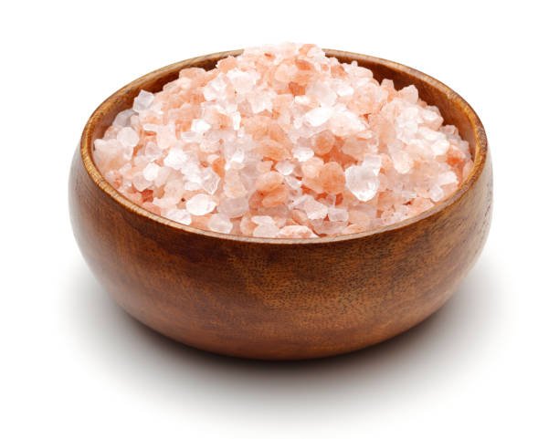 Himalaya salt in wooden bowl isolated on white background